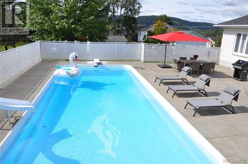 110 Bossé Avenue, Edmundston, NB - Outdoor With In Ground Pool With Backyard