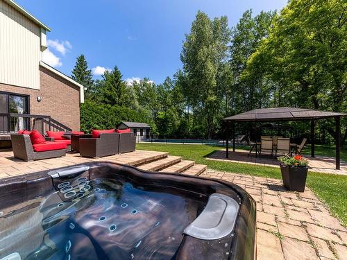 Hot tub - 2200 Rue Gardenvale, Saint-Bruno-De-Montarville, QC - Outdoor With Backyard