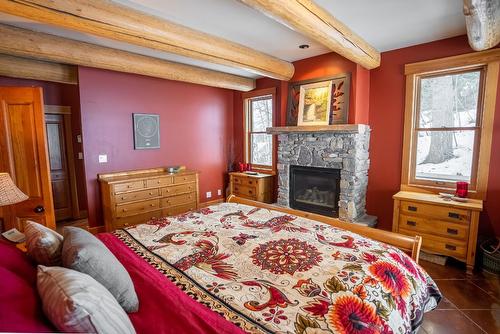 6016 Cunliffe Road, Fernie, BC - Indoor Photo Showing Bedroom With Fireplace