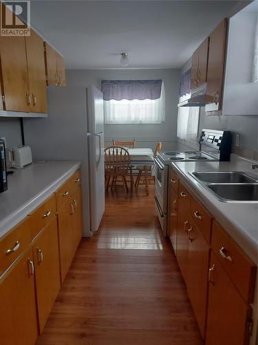 16 A/B And 18 Currie Avenue, Port Aux Basques, NL - Indoor Photo Showing Kitchen With Double Sink