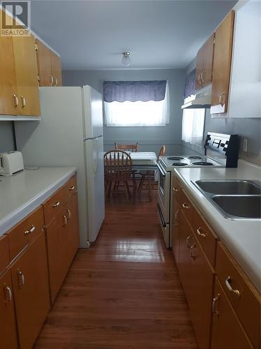 16 A/B And 18 Currie Avenue, Port Aux Basques, NL - Indoor Photo Showing Kitchen With Double Sink