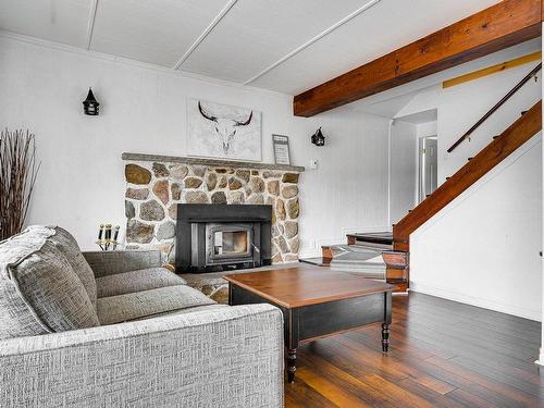 Salle familiale - 830 Ch. Du Lac, Saint-Sauveur, QC - Indoor Photo Showing Living Room With Fireplace