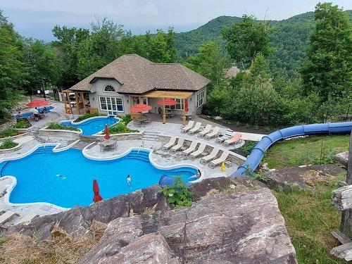 Pool - 4-290 Rue Du Mont-Plaisant, Mont-Tremblant, QC - Outdoor With In Ground Pool With Backyard
