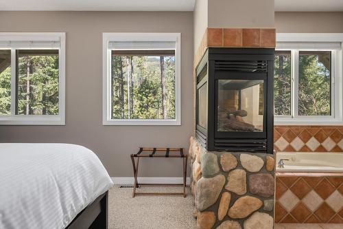 2136 Panorama Drive, Panorama, BC - Indoor Photo Showing Bedroom With Fireplace