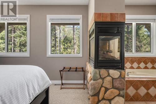 2136 Panorama  Drive, Panorama, BC - Indoor Photo Showing Bedroom With Fireplace