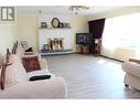 15 Munro Crescent, Mackenzie, BC  - Indoor Photo Showing Living Room With Fireplace 