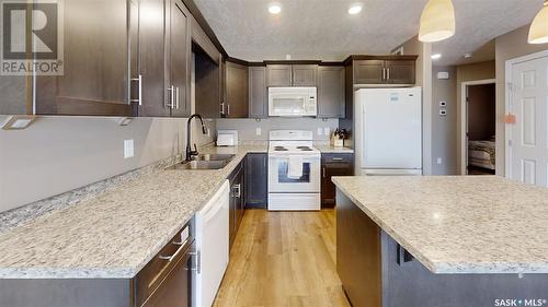 712 713  714  716 Columbia Avenue, Kerrobert, SK - Indoor Photo Showing Kitchen With Double Sink