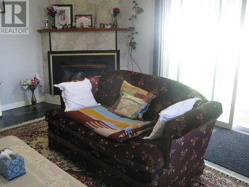 4 Blackwater Crescent, Mackenzie, BC - Indoor Photo Showing Living Room With Fireplace