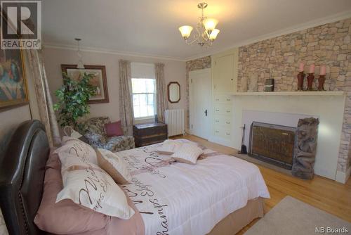 327 Mowat Drive, Saint Andrews, NB - Indoor Photo Showing Bedroom With Fireplace
