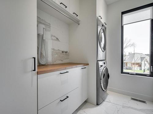 Salle de lavage - 67 Av. Du Vicomte, Saint-Sauveur, QC - Indoor Photo Showing Laundry Room