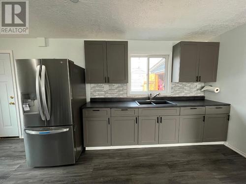 5002 48 Avenue, Pouce Coupe, BC - Indoor Photo Showing Kitchen With Double Sink