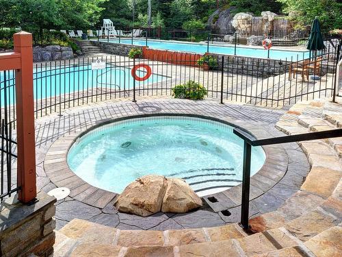 Hot tub - 2-209 Ch. Des Quatre-Sommets, Mont-Tremblant, QC - Outdoor With In Ground Pool With Backyard