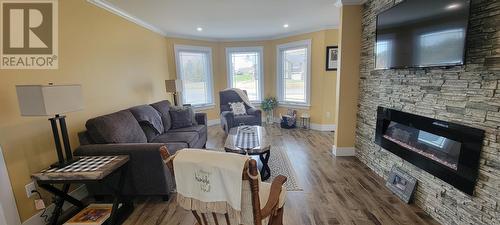 1 Isaac'S Point Street, Marystown, NL - Indoor Photo Showing Living Room With Fireplace
