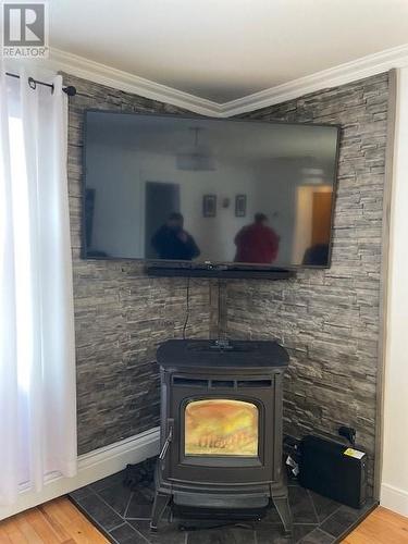 13 Stacey Crescent, Stephenville, NL - Indoor Photo Showing Other Room With Fireplace