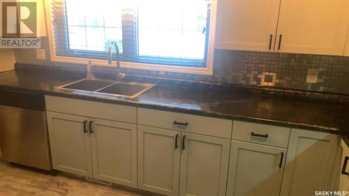 216 Dominion Road, Assiniboia, SK - Indoor Photo Showing Kitchen With Double Sink