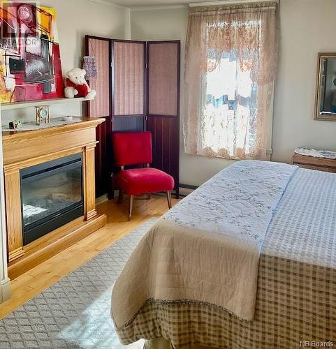 336 Ledge Road, St. Stephen, NB - Indoor Photo Showing Bedroom With Fireplace
