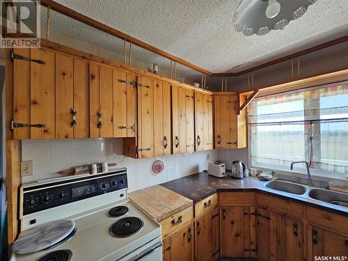 St.Cyr Acreage, Swift Current, SK - Indoor Photo Showing Kitchen With Double Sink