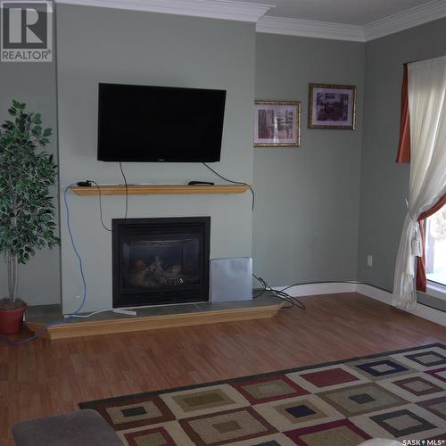 6 4Th Avenue Sw, Weyburn, SK - Indoor Photo Showing Living Room With Fireplace