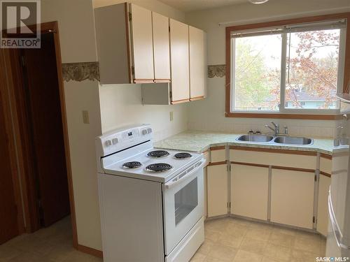 719 - 723 5Th Street Ne, Weyburn, SK - Indoor Photo Showing Kitchen With Double Sink