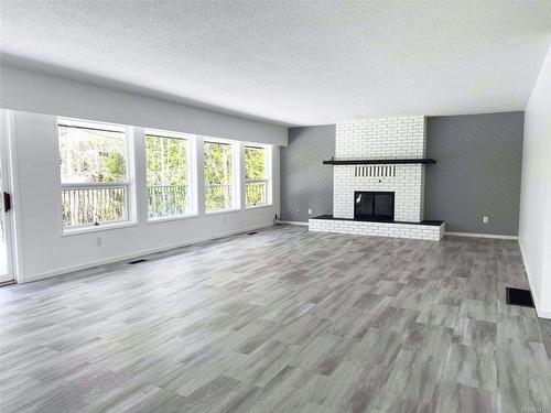 4071 Nimpkish Cres, Woss, BC - Indoor Photo Showing Living Room With Fireplace