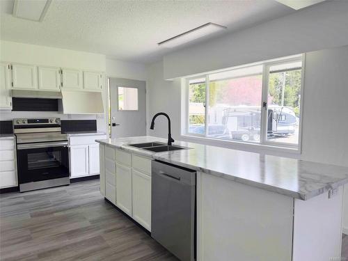 4071 Nimpkish Cres, Woss, BC - Indoor Photo Showing Kitchen With Double Sink