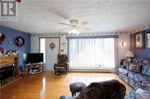 90 Waddell, Saint-André, NB - Indoor Photo Showing Living Room With Fireplace
