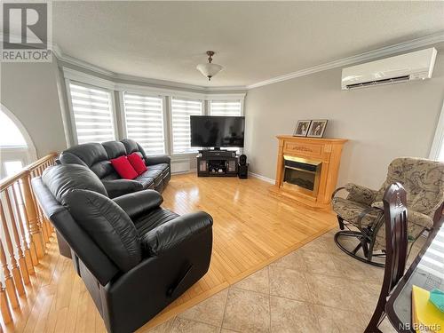 4 Rue Dr. R. Boulay, Kedgwick, NB - Indoor Photo Showing Living Room With Fireplace