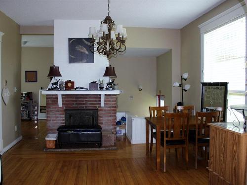 303 River Ave, Rainy River, ON - Indoor Photo Showing Dining Room With Fireplace