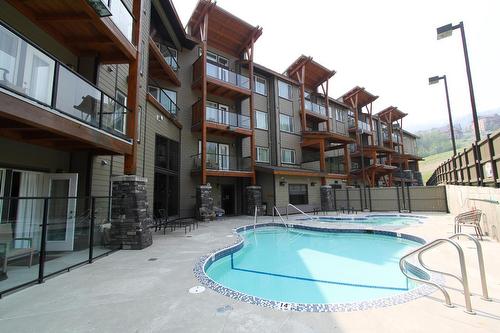 103 - 400 Stemwinder Drive, Kimberley, BC - Outdoor With In Ground Pool