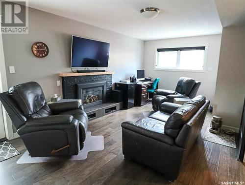 346 Walsh Trail, Swift Current, SK - Indoor Photo Showing Living Room With Fireplace