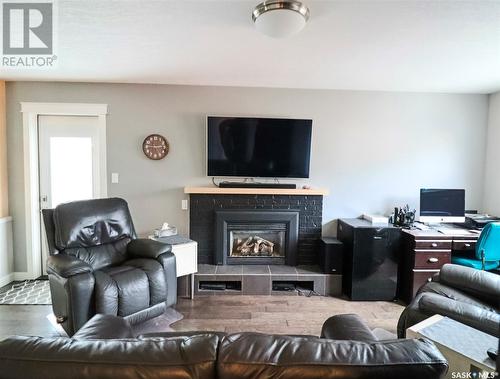 346 Walsh Trail, Swift Current, SK - Indoor Photo Showing Other Room With Fireplace