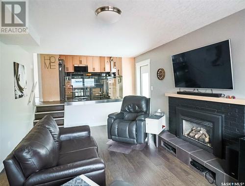 346 Walsh Trail, Swift Current, SK - Indoor Photo Showing Living Room With Fireplace
