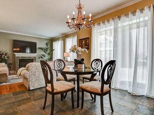 Dinette - 7655 Rue Liege, Brossard, QC - Indoor Photo Showing Dining Room With Fireplace