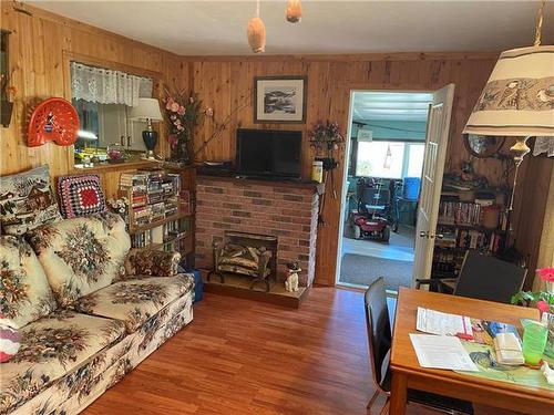 219 Elm Drive, Oak Lake Beach, MB - Indoor With Fireplace