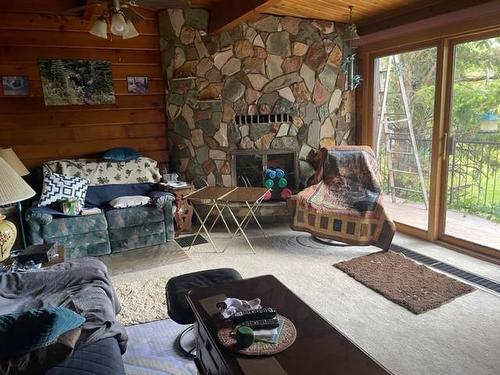 4007 Gadsby Road, Ta Ta Creek, BC - Indoor Photo Showing Living Room With Fireplace