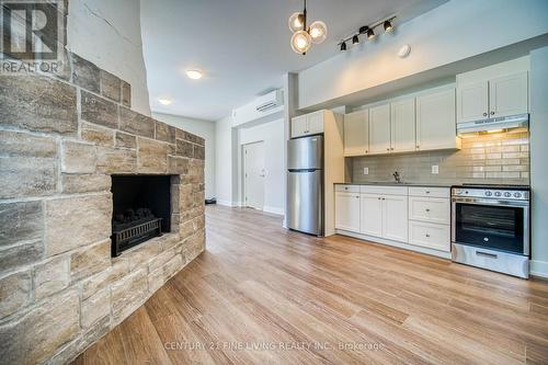 1614 Ridge Rd E, Oro-Medonte, ON - Indoor Photo Showing Kitchen With Fireplace