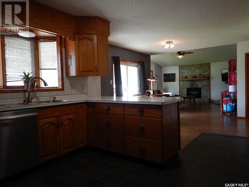 307 Finley Avenue, Cut Knife, SK - Indoor Photo Showing Kitchen With Fireplace With Double Sink