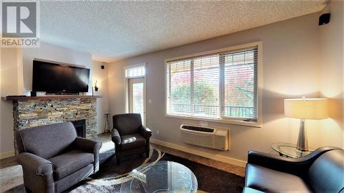 500 Bighorn  Boulevard Unit# 523 B, Radium Hot Springs, BC - Indoor Photo Showing Living Room With Fireplace