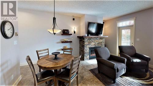 500 Bighorn  Boulevard Unit# 523 B, Radium Hot Springs, BC - Indoor Photo Showing Other Room With Fireplace