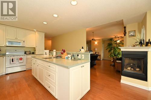 875/877 Armentieres Road, Sorrento, BC - Indoor Photo Showing Kitchen With Fireplace