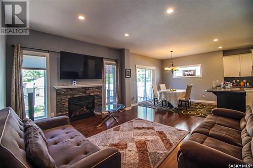 3325 Green Moss Lane, Regina, SK - Indoor Photo Showing Living Room With Fireplace