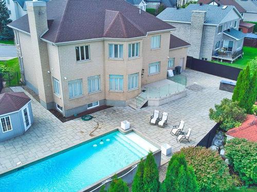 Aerial photo - 239 Rue Lacoste, Laval (Sainte-Dorothée), QC - Outdoor With In Ground Pool With Exterior