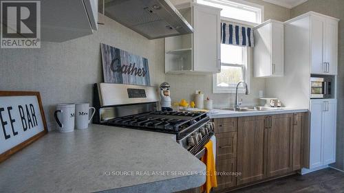 #8 -7100 County Rd 18, Alnwick/Haldimand, ON - Indoor Photo Showing Kitchen With Double Sink