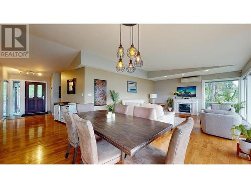 9890 Eastside Road, Vernon, BC - Indoor Photo Showing Dining Room With Fireplace