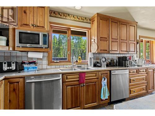 7915 Machete Lake Road, Bridge Lake, BC - Indoor Photo Showing Kitchen With Double Sink