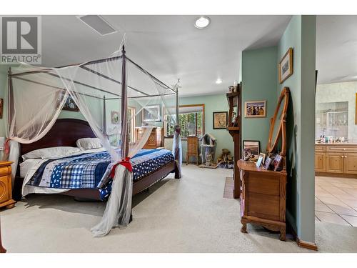 7915 Machete Lake Road, Bridge Lake, BC - Indoor Photo Showing Bedroom
