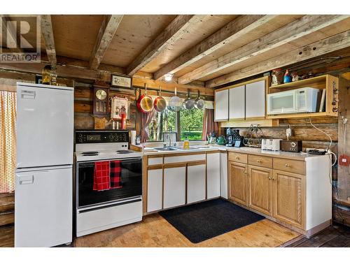 7915 Machete Lake Road, Bridge Lake, BC - Indoor Photo Showing Kitchen With Double Sink