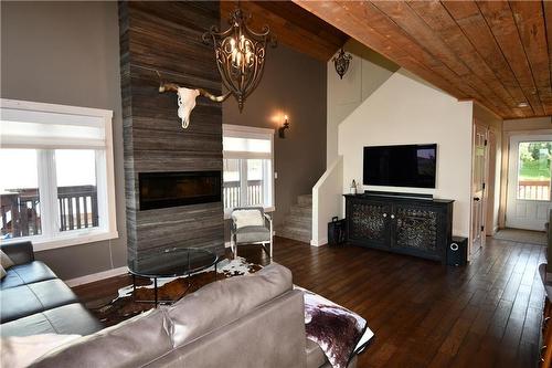 96 Copper Cove, Inglis, MB - Indoor Photo Showing Living Room With Fireplace
