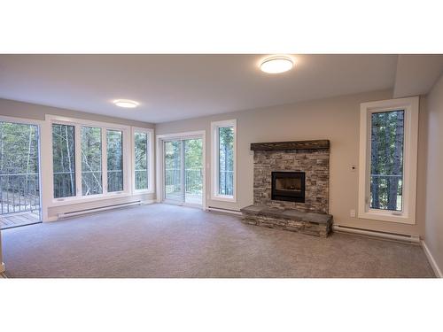 1 - 7977 Radium Golf Course Road, Radium Hot Springs, BC - Indoor Photo Showing Living Room With Fireplace