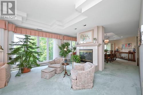 401 - 10 Armstrong Drive, Smiths Falls, ON - Indoor Photo Showing Living Room With Fireplace